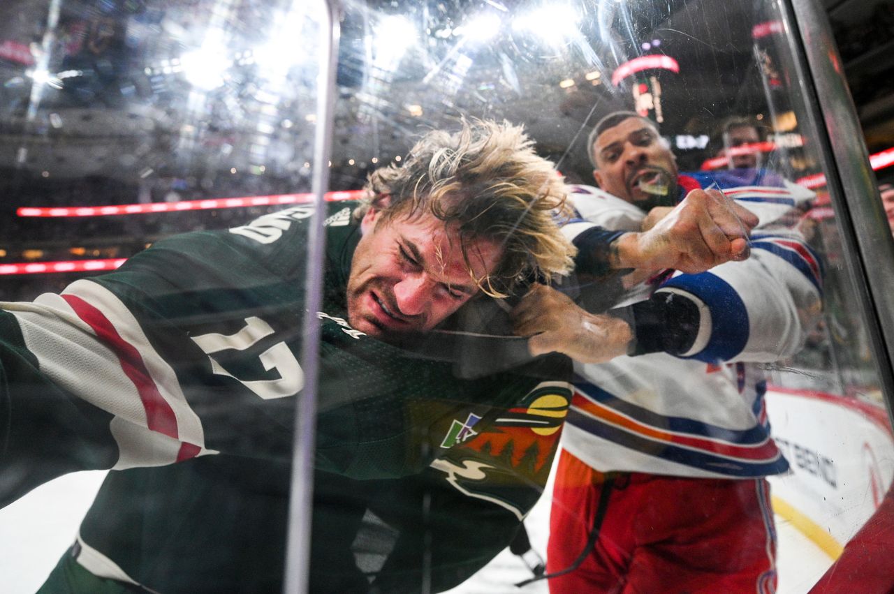Ryan Reaves of the New York Rangers punches Marcus Foligno of the Minnesota Wild during a NHL hockey game in St. Paul, Minnesota, on Thursday, October 13.