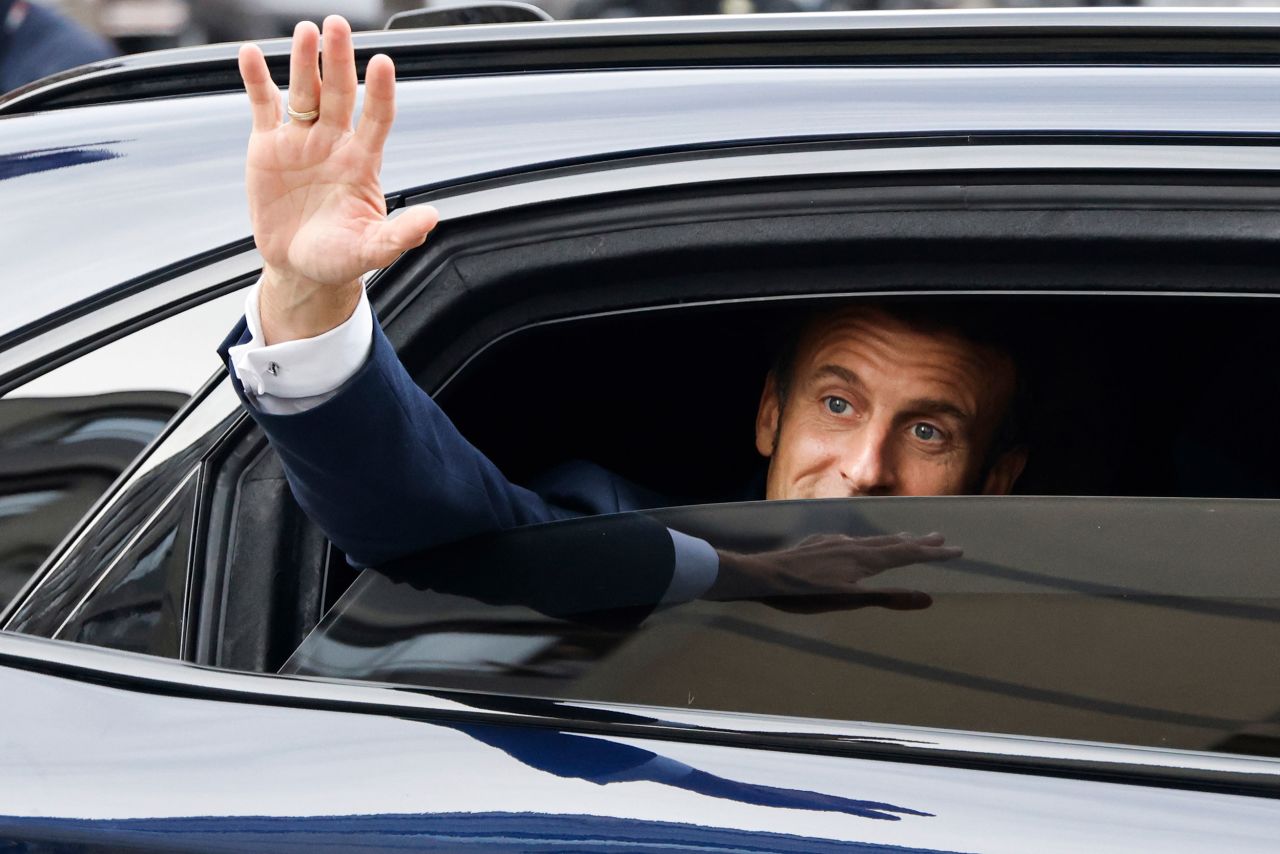 French President Emmanuel Macron waves goodbye on Wednesday, October 19, after visiting the Grand Mosque of Paris to commemorate 100 years since it was built.