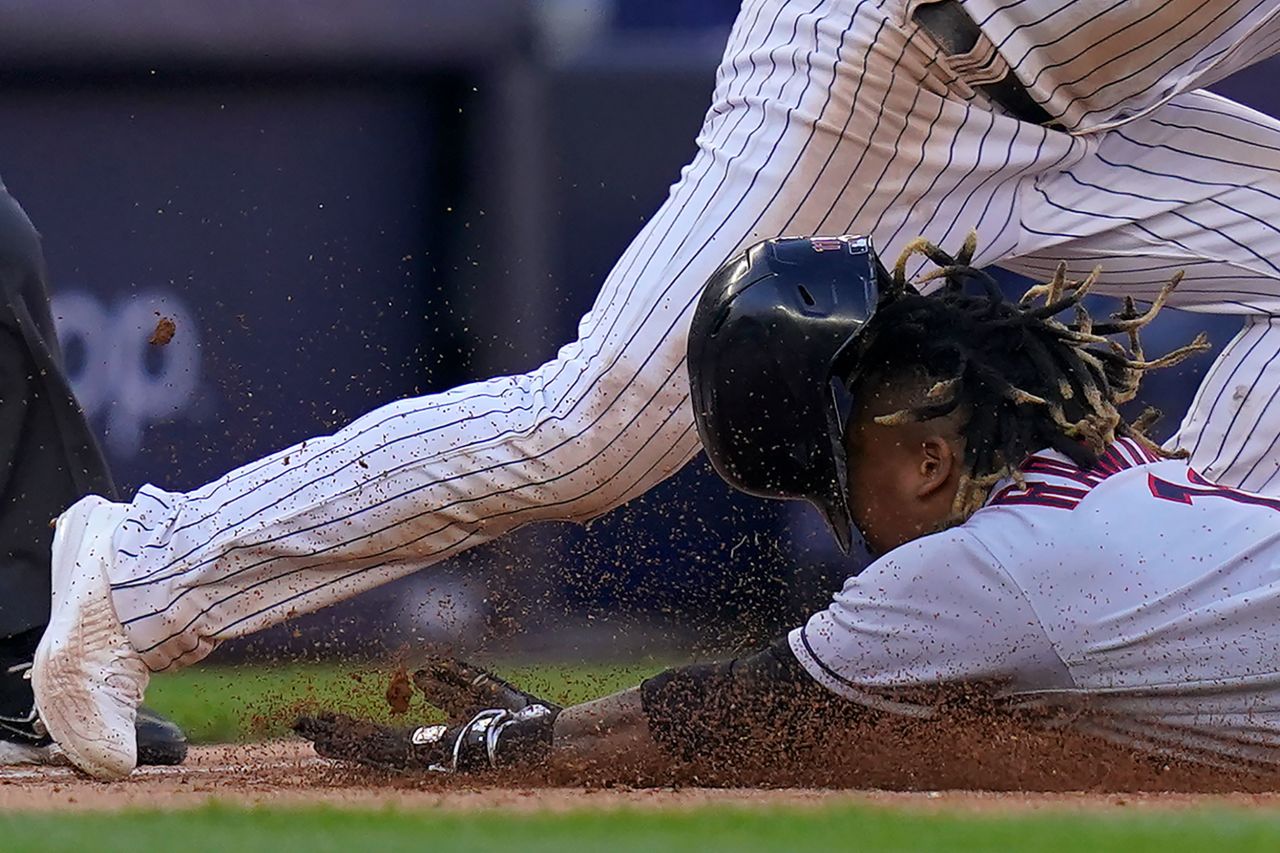 Jose Ramirez of the Cleveland Guardians dives safely into third base during an American League Division Series baseball game against the New York Yankees on Friday, October 14. Cleveland won the game 4-2 but lost the series to New York in five games.