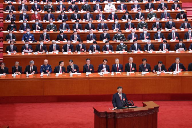 Chinese leader Xi Jinping delivers a speech during the opening session of the<a href="index.php?page=&url=https%3A%2F%2Fwww.cnn.com%2F2022%2F10%2F16%2Fasia%2Fgallery%2Fchina-20th-communist-party-congress%2Findex.html" target="_blank"> 20th Communist Party Congress</a> at the Great Hall of the People in Beijing on Sunday, October 16. Xi is poised to secure a norm-breaking third term in power.
