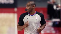 FILE - Referee Tony Brown runs on the sideline during the first half of an NBA basketball game between the Detroit Pistons and the Toronto Raptors, March 17, 2021, in Detroit. Brown, who was diagnosed with Stage 4 pancreatic cancer in April 2021, died Thursday, Oct. 20, 2022. He was 55. (AP Photo/Carlos Osorio, File)