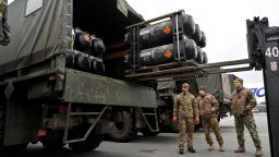 Ukrainian servicemen load a truck with the FGM-148 Javelin, American man-portable anti-tank missile provided by US to Ukraine as part of a military support, upon its delivery at Kyiv's airport Boryspil on February 11,2022, amid the crisis linked with the threat of Russia's invasion.