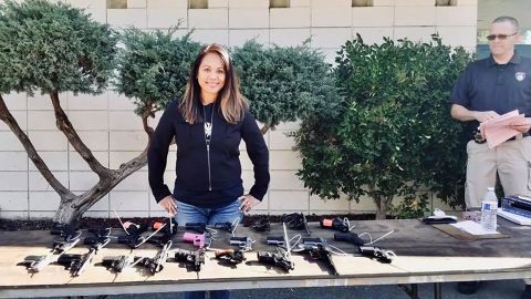 Navalta with some of the guns she's collected via her buyback program.