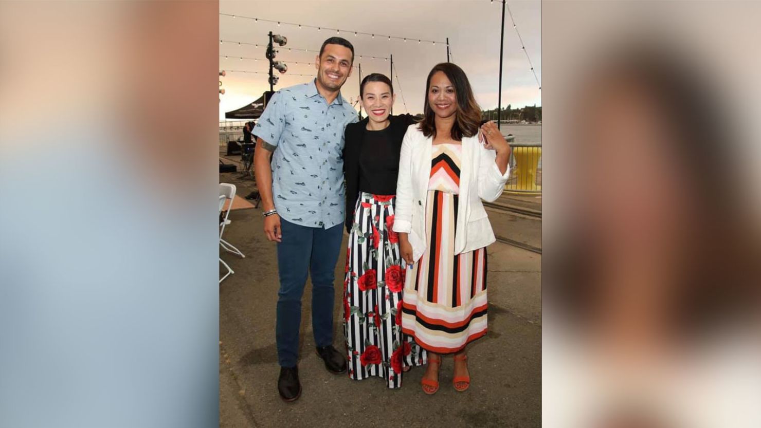 Maurice Solis, from left, with his wife Anh Solis and Pati Navalta. Solis and Navalta have bridged their differing views on gun control to become friends.