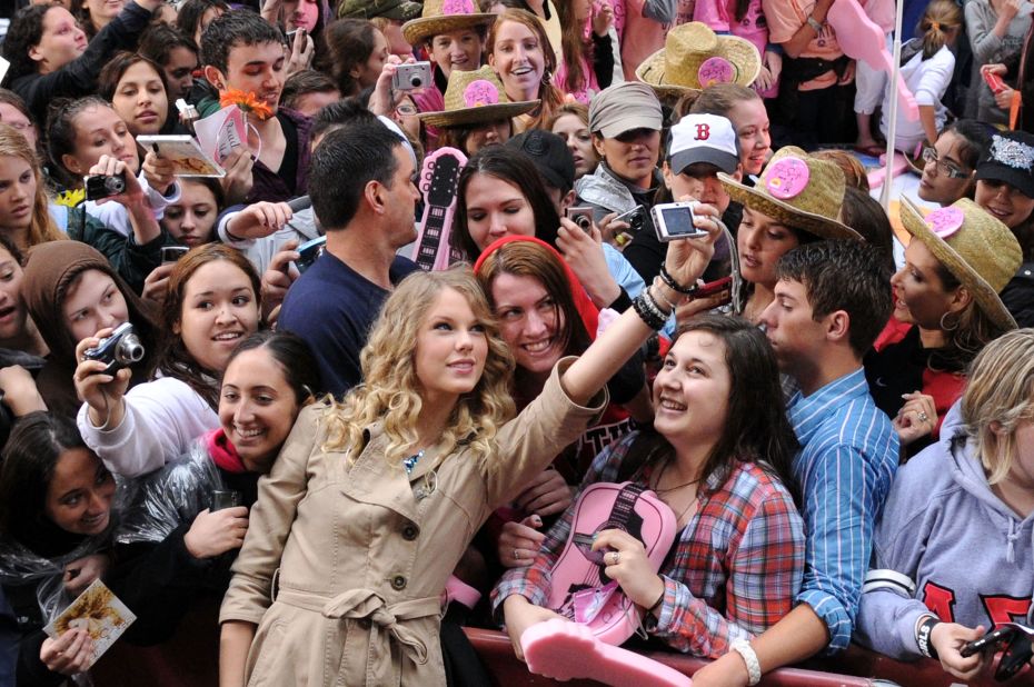 Swift takes pictures with fans on NBC's "Today" show at New York's Rockefeller Center in 2009.