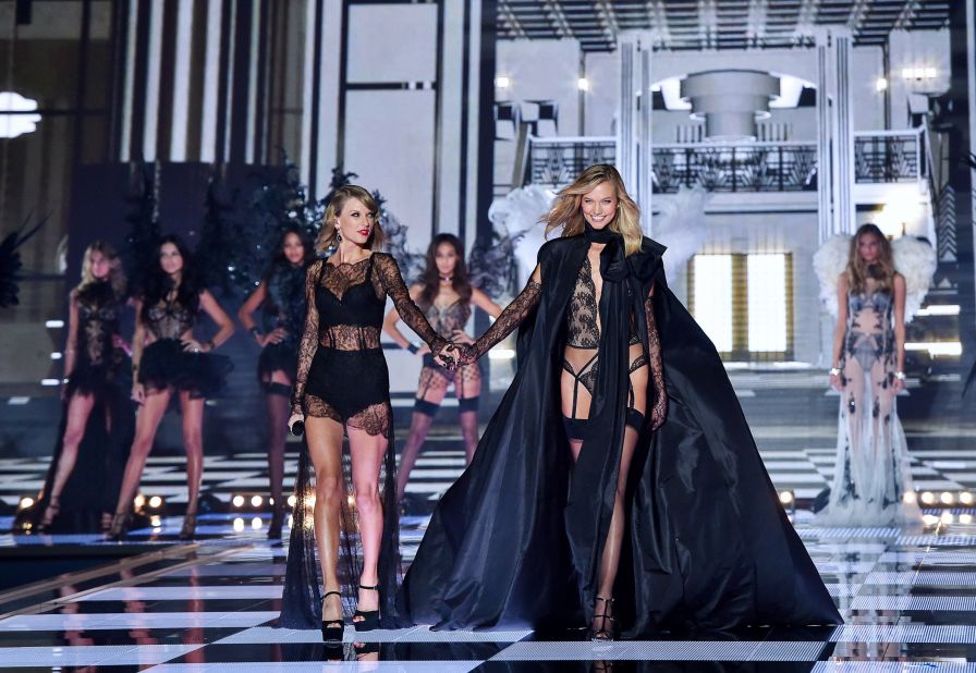 Swift and Karlie Kloss walk down the runway during the Victoria's Secret fashion show in London in 2014.