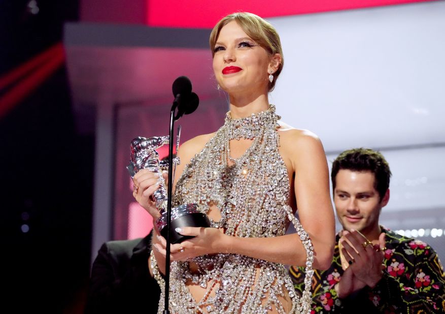 Swift accepts the video of the year award for "All Too Well" at the 2022 MTV Video Music Awards. She wrote and directed the music video. 