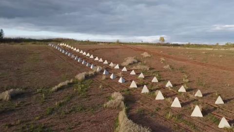 An image, taken by Russian tabloid outlet RIA/FAN, shows two rows of the anti-tank pyramids sitting in the field just outside of Russian-occupied Hirske, Ukraine.