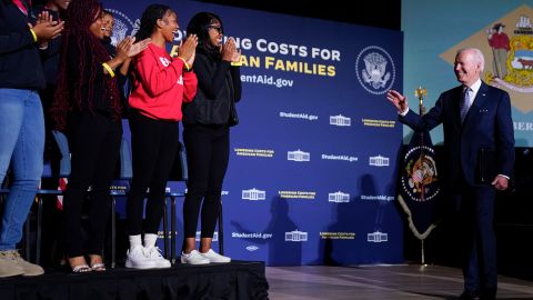 President Joe Biden waves to students as he arrives to speak about student loan debt relief at Delaware State University on Friday.