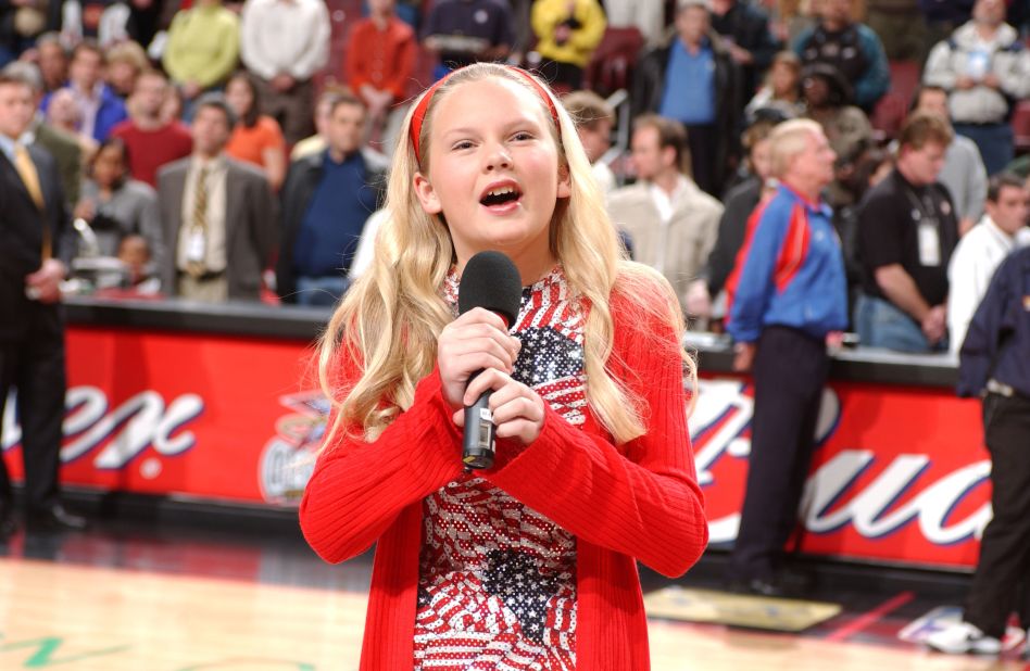 A 13-year-old Swift sings the National Anthem before an NBA game in Philadelphia in 2002.