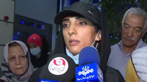 Iranian climber Elnaz Rekabi speaks to journalists upon her arrival at the Imam Khomeini International Airport in Tehran on Oct. 19, 2022.