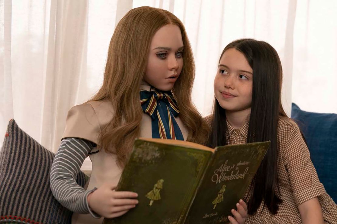 In 'M3GAN,' Cady (Violet McGraw, right) is gited a hi-tech new friend. 