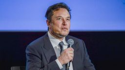 Tesla CEO Elon Musk looks up as he addresses guests at the Offshore Northern Seas 2022 (ONS) meeting in Stavanger, Norway on August 29, 2022. - The meeting, held in Stavanger from August 29 to September 1, 2022, presents the latest developments in Norway and internationally related to the energy, oil and gas sector.