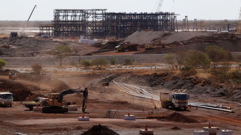 A truck drives past machinery at Hancock Prospecting Pty's Roy Hill Mine in the Pilbara region of Western Australia.