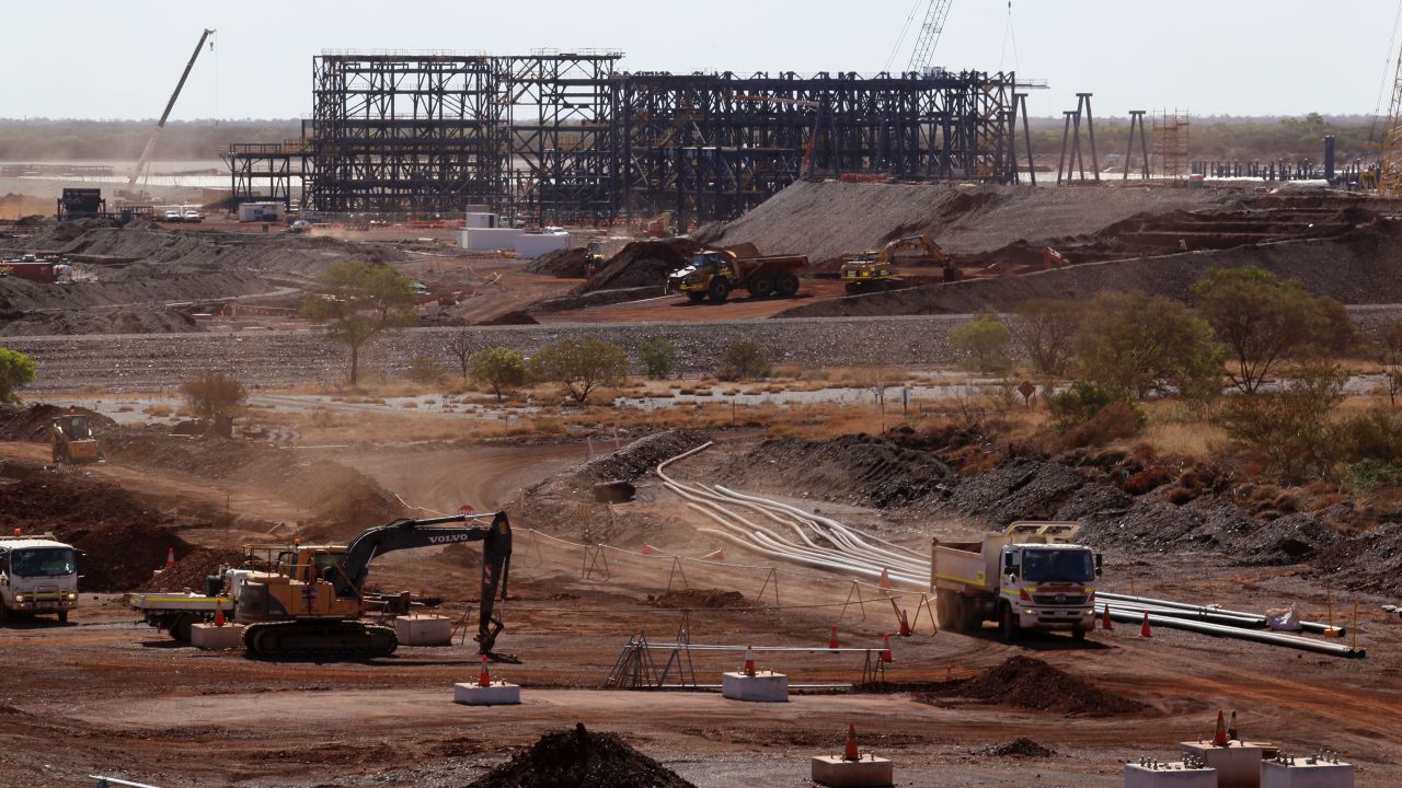 A truck drives past machinery at Hancock Prospecting Pty's Roy Hill Mine operations in the Pilbara region, Western Australia.