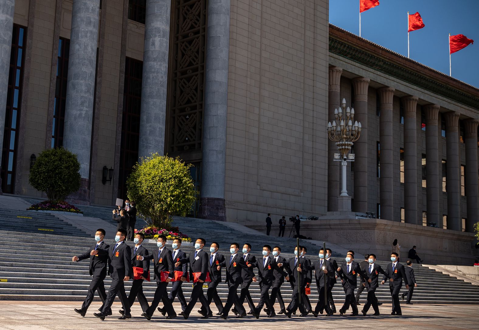 Security guards in front of the Great Hall of the People in Beijing at the end of the closing ceremony.