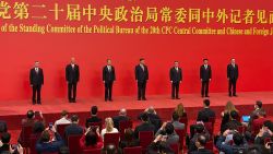 New members of the Politburo Standing Committee, from left, Li Xi, Cai Qi, Zhao Leji, President Xi Jinping, Li Qiang, Wang Hunting, and Ding Xuexiang are introduced at the Great Hall of the People in Beijing, Sunday, Oct. 23, 2022.