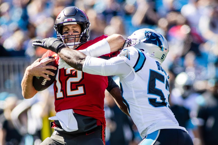 It was tough times for the Tampa Bay Buccaneers and Tom Brady on Sunday against the Carolina Panthers. Brady — sacked here by Panthers defensive end Brian Burns — and the Bucs failed to score a touchdown in a 21-3 loss to Carolina to send Tampa Bay to 3-4 on the year. Despite the loss, the Bucs are still first place in the lowly NFC South.