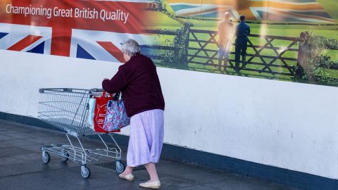 A customer pushes a shopping cart into an Aldi supermarket in Sheffield on Saturday, October 15.