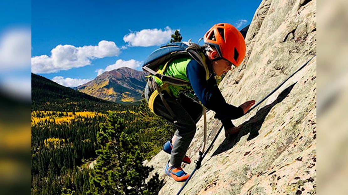 Sam Baker was in a climbing harness "before he could walk" his dad said.