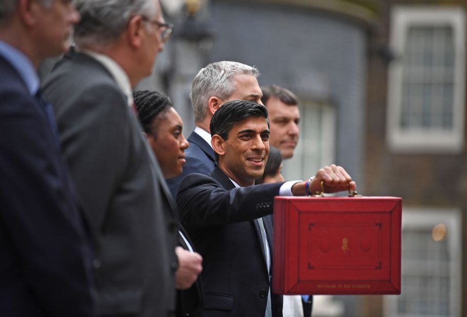 Sunak is seen outside 11 Downing Street in London before heading to the House of Commons to deliver his budget in March 2020.