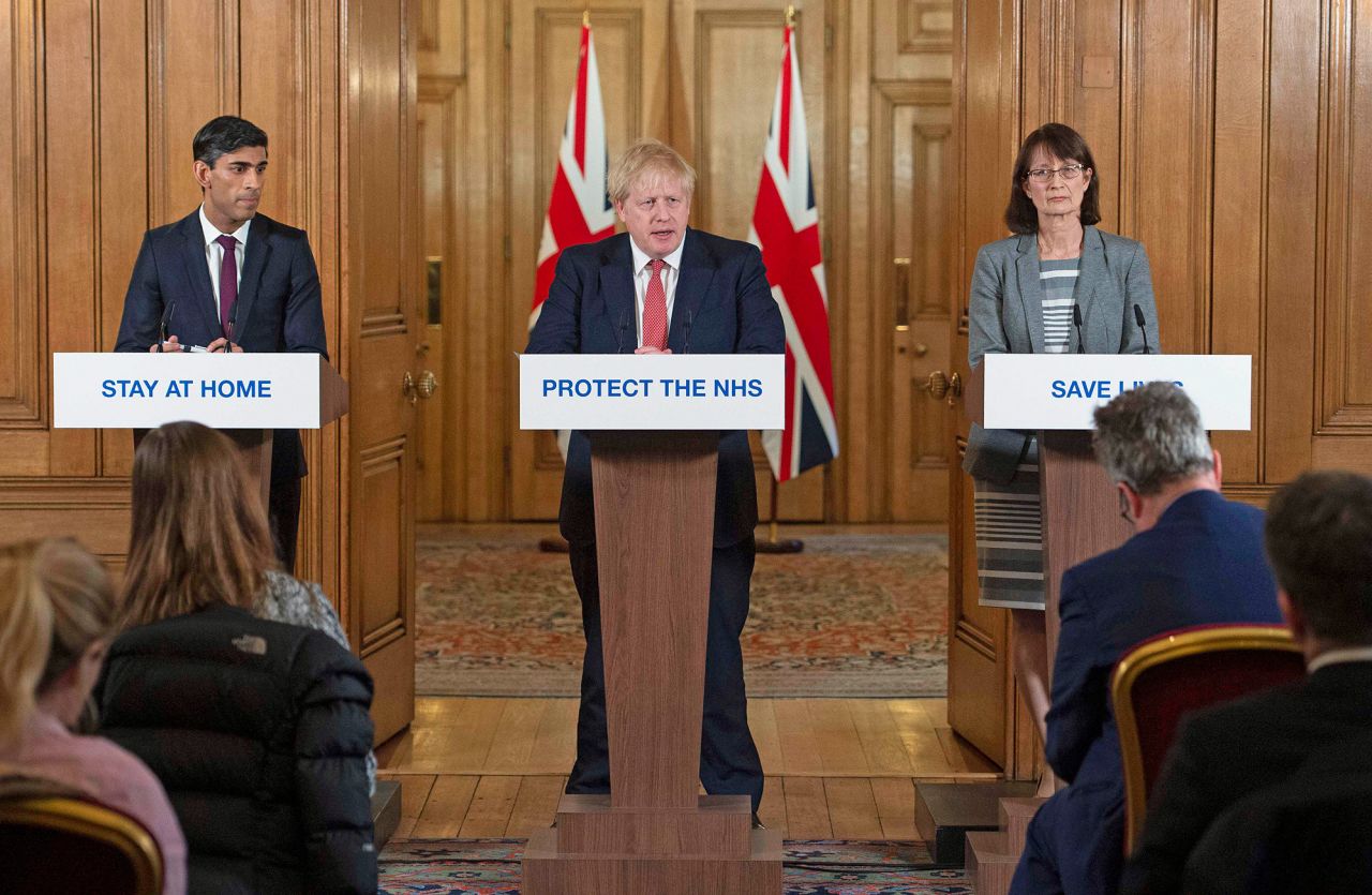 From left, Sunak, Johnson and Dr. Jenny Harries speak about the coronavirus pandemic at a media briefing in London in March 2020. Sunak won popularity during the early weeks of the pandemic when he unveiled an extensive support plan for those unable to work during lockdown.