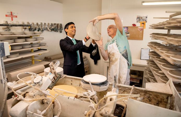 Sunak learns the art of handling clay to make plates during a visit to a pottery business in Stoke-on-Trent, England, in September 2020. Employees were returning to work after being furloughed.
