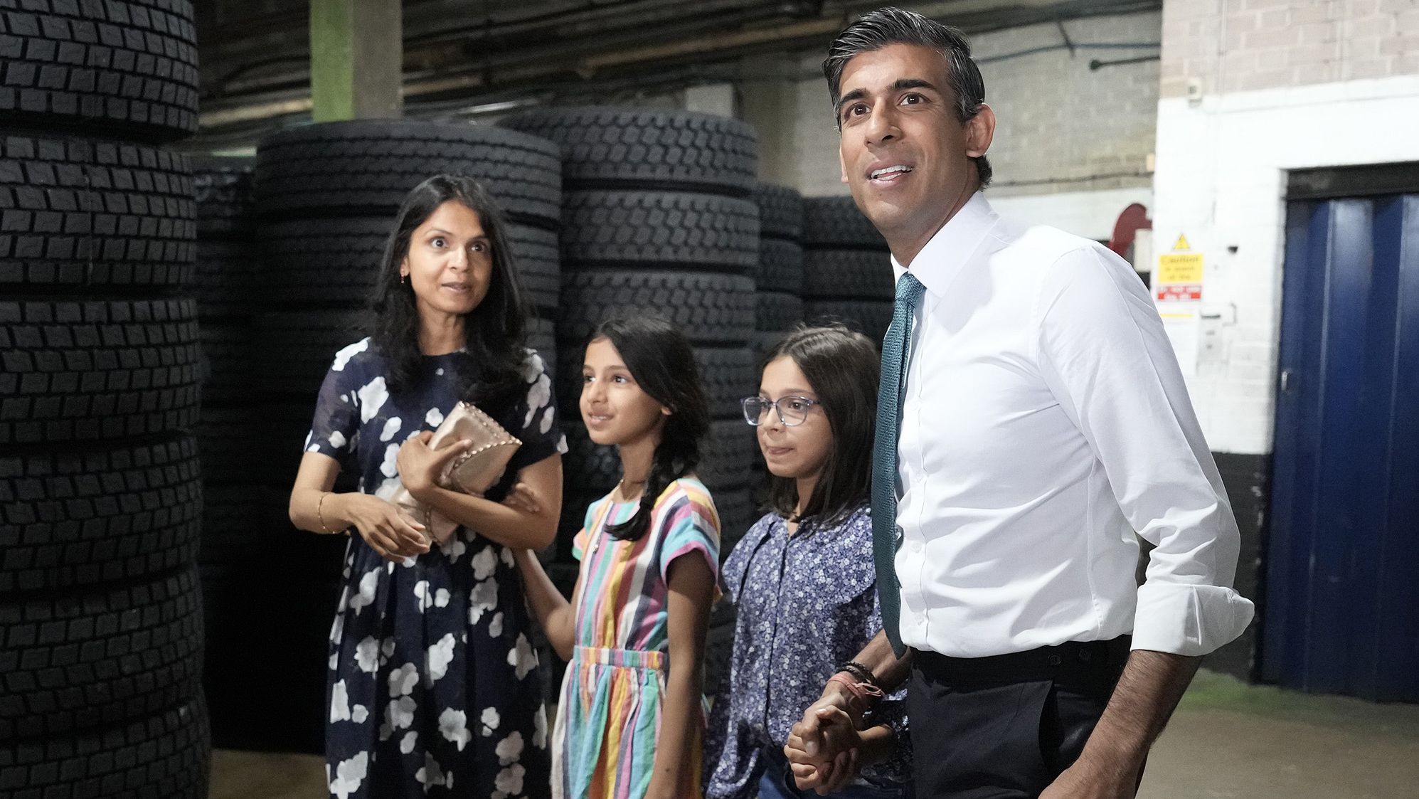 Sunak and Murty are seen with their daughters, Krishna and Anoushka, while campaigning in Grantham, England, in July 2022.