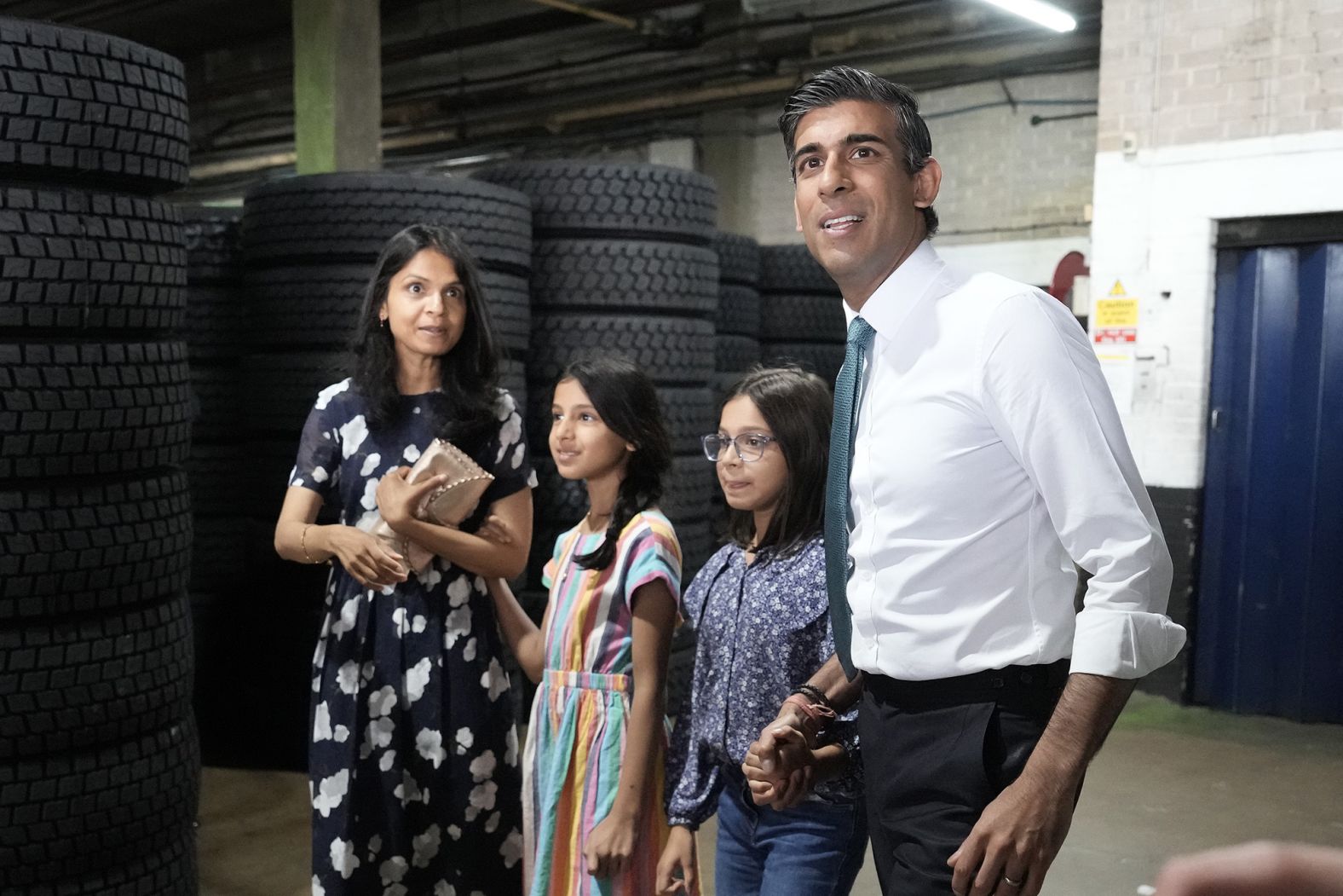 Sunak and Murty are seen with their daughters, Krishna and Anoushka, while campaigning in Grantham, England, in July 2022.