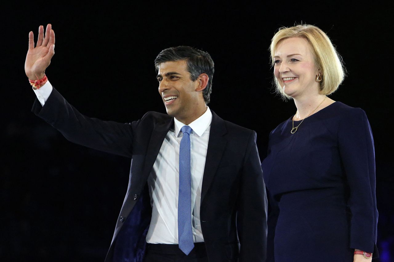 Sunak and Liz Truss stand together on stage during the final Conservative Party Hustings event in London in August 2022. At the time, they were the final two contenders to become the country's next Prime Minister. Truss defeated Sunak with 81,326 votes to 60,399 among party members. When she announced her resignation weeks later, he became the frontrunner to replace her.