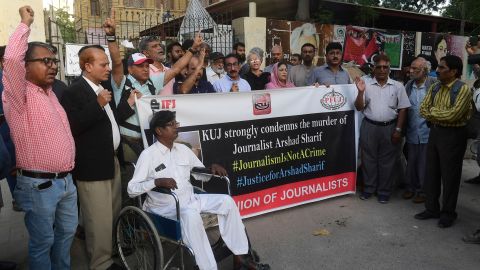 Media representatives shout slogans during a protest in Karachi on October 24, 2022.