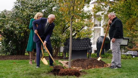 President Joe Biden, first lady Jill Biden and Dale Haney, the chief White House groundskeeper, right, participate in a tree planting ceremony on the South Lawn of the White House, October 24, 2022, in Washington. 