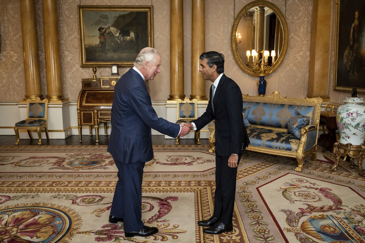 King Charles III welcomes Sunak during an audience at Buckingham Palace, where he invited the newly elected leader of the Conservative Party to become prime minister on October 25.