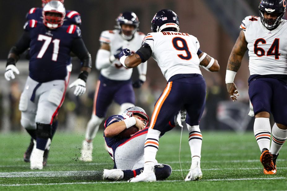 New England Patriots quarterback Mac Jones slides and accidentally kicks Chicago Bears safety Jaquan Brisker in the groin. Later on in the drive, Brisker got his revenge though with an impressive one-handed interception — one of three picks on the evening for "Da Bears" in a 33-14 win for Chicago.