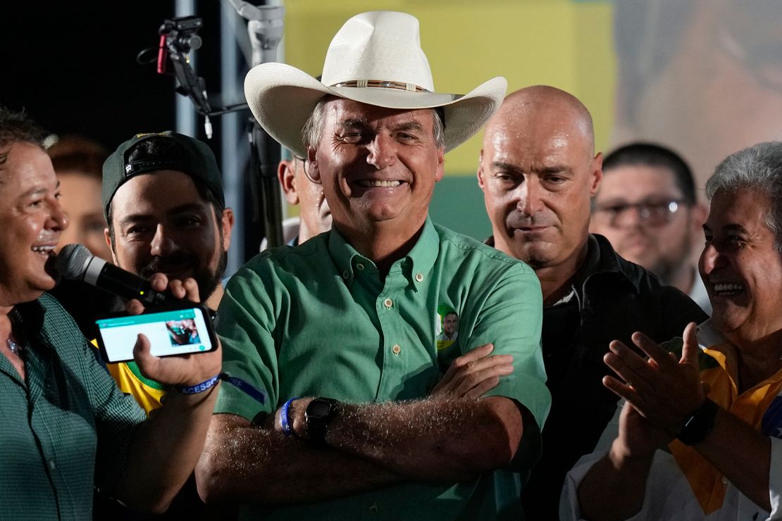 Brazil's President Jair Bolsonaro, who is running for a second term, smiles during a campaign rally in Guarulhos, the great Sao Paulo area, on October 22, 2022.