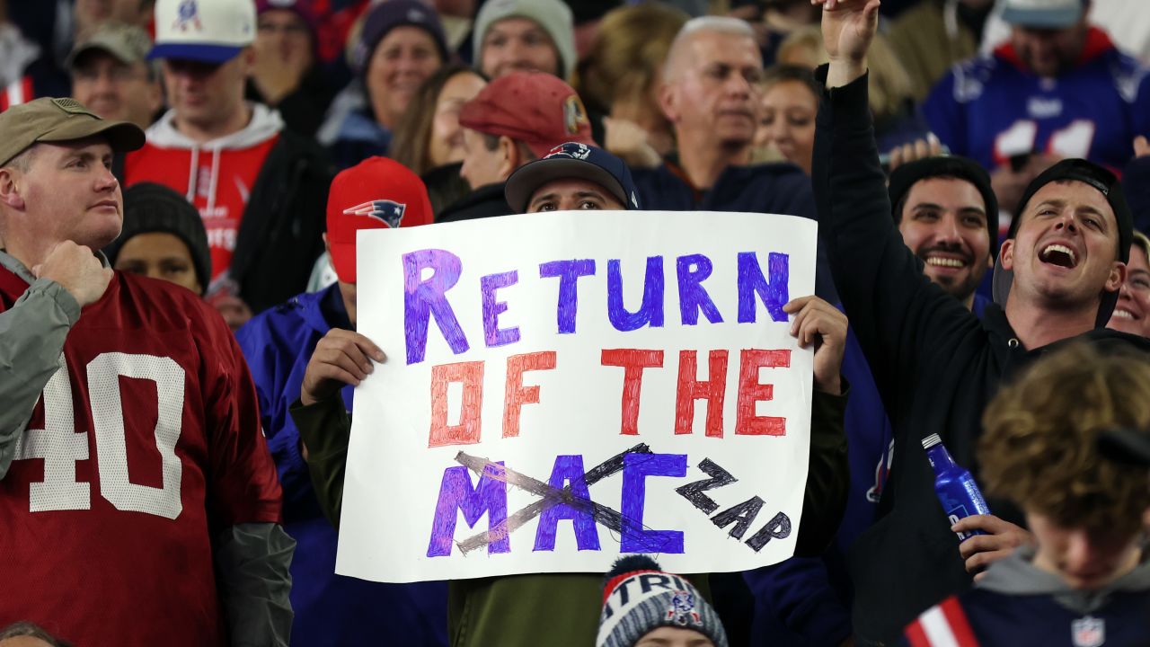 A New England Patriots fan holds a sign during the game against the Bears.