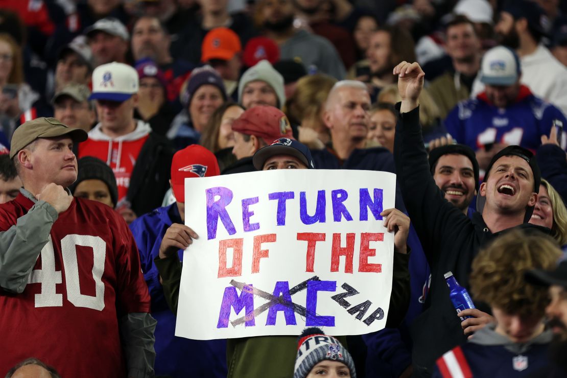 A New England Patriots fan holds a sign during the game against the Bears.