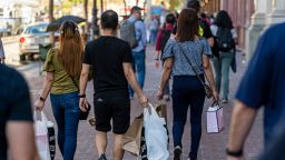 Shoppers carry bags in San Francisco, California, US, on Thursday, Sept. 29, 2022. US consumer confidence rose for a second month in September to the highest since April, indicating a strong job market and lower gas prices are contributing to more optimistic views of the economy. 