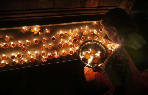 A Hindu devotee celebrates Diwali at a temple in Colombo, Sri Lanka, on Monday, October 24.