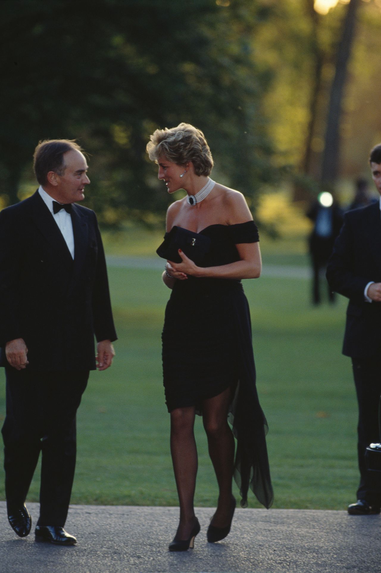 Princess Diana wearing the black Christina Stambolian dress while attending a party at the Serpentine Gallery in London, June 1994. 