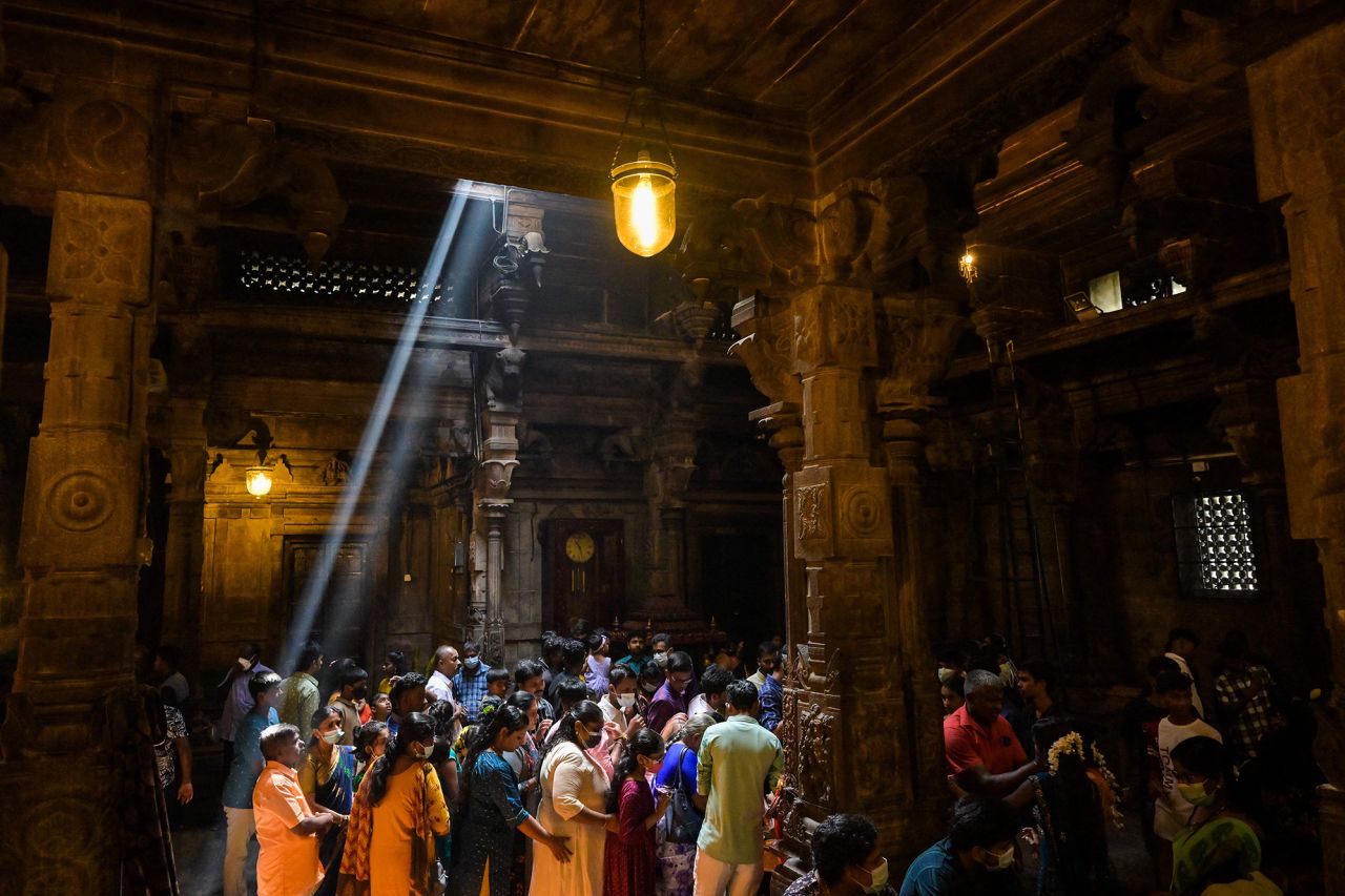 Devotees offer prayers at a temple in Colombo.