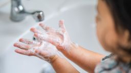 toddler washing hands