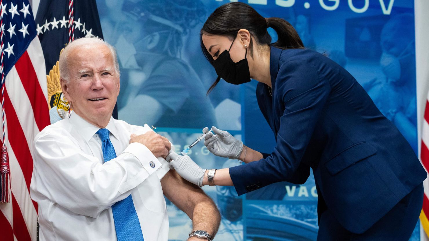 US President Joe Biden receives the latest Covid-19 booster shot in the South Court Auditorium of the Eisenhower Executive Office Building, next to the White House, in Washington, DC, on October 25, 2022. (Photo by SAUL LOEB / AFP) (Photo by SAUL LOEB/AFP via Getty Images)