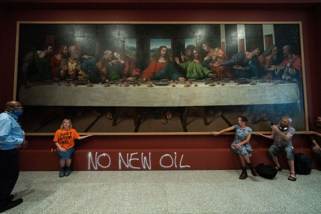 Activists from Just Stop Oil spray painted the wall beneath a Leonardo pupil's copy of "The Last Supper" and glued themselves to the frame.