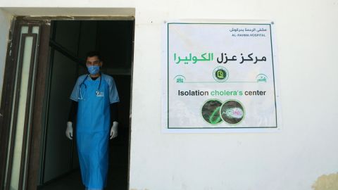 A medic walks at a recently opened medical center for cholera cases in the Syrian town of Darkush, on the outskirts of the rebel-held province of Idlib, on Saturday.