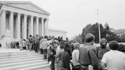 About 500 spectators line up outside the Supreme Court in Washington, D.C., Oct. 12, 1977, in hopes of being among the group of about 50 who will be allowed to hear at least a portion of the arguments in the "reverse discrimination" case of Allan Bakke. The court is prepared to spend less than two hours hearing oral arguments in that case. (AP Photo/Jeff Taylor)