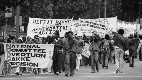 Demonstrators sponsored by the National Committee to Overturn the Bakke Decision march along Pennsylvania Avenue in Washington, Oct. 8, 1977. 