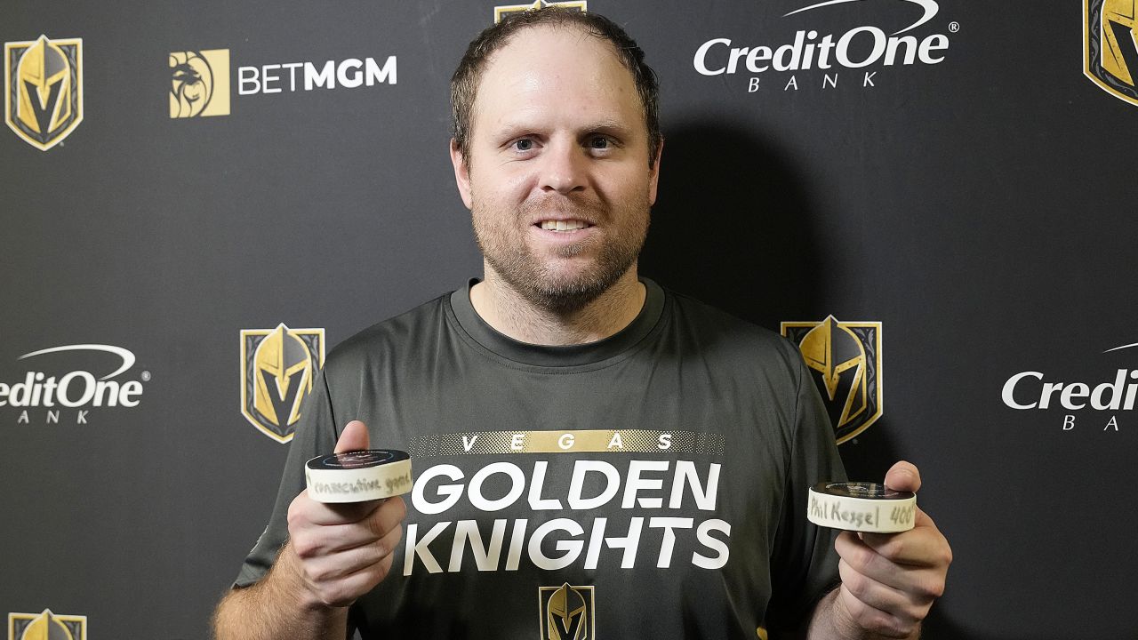 Kessel poses with the pucks from his 990th consecutive NHL game.