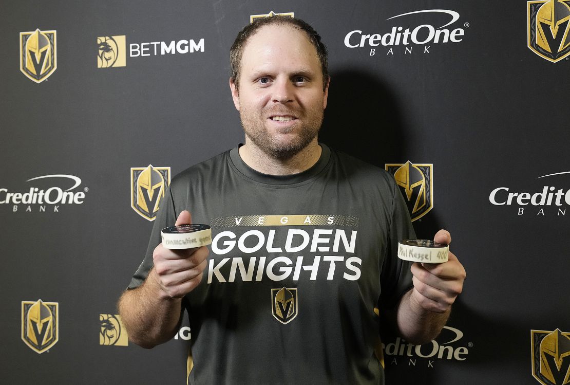 Kessel poses with the pucks from his 990th consecutive NHL game.