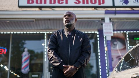 Aaron Bethea poses outside the Anytime Katz barbershop in Atlanta.
